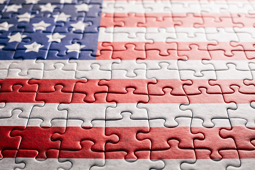 American flag jigsaw puzzle on wood.