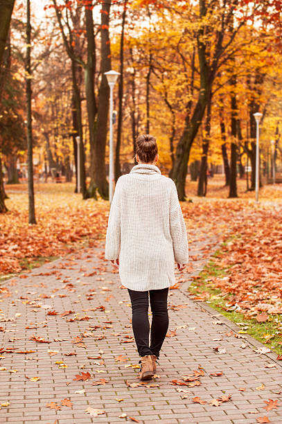 istock Fall relaxation concept with female walking 599880842