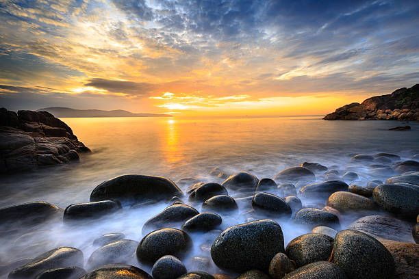 istock Long exposure of wave sea and the big pebbles 599880932