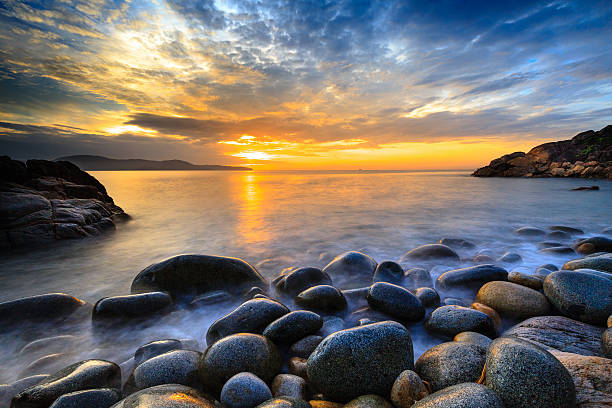 istock Long exposure of wave sea and the big pebbles 599880962