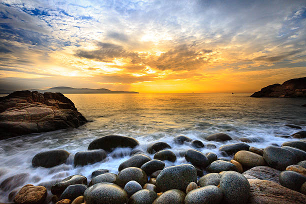 istock Long exposure of wave sea and the big pebbles 599881284