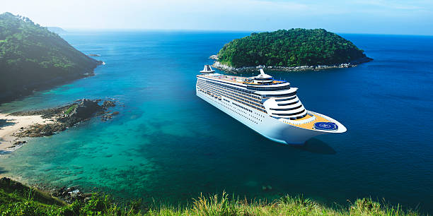 A ship waits on the horizon on a beautiful beach in the Caribbean.