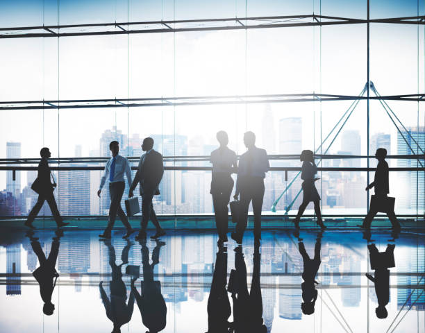 istock Silhouette Business People Commuter Walking Rush Hour Concept 599881714