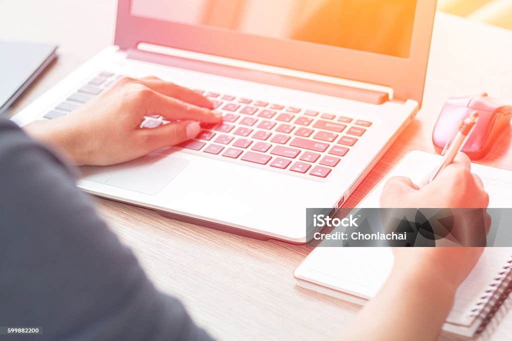 Close Up of woman hands using mobile phone Close Up of woman hands using mobile phone and laptop computer business with blank copy space screen for your business advertising text message or content business in the morning light. Education Training Class Stock Photo