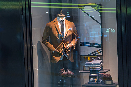 Male mannequin wearing a suit and accessories. Sale