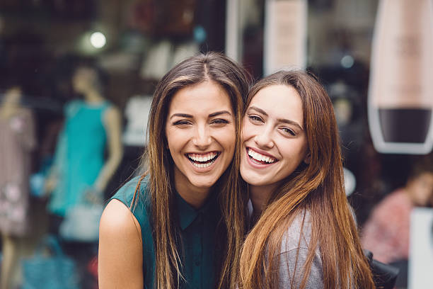Happy women Happy girls smiling to the camera sister stock pictures, royalty-free photos & images