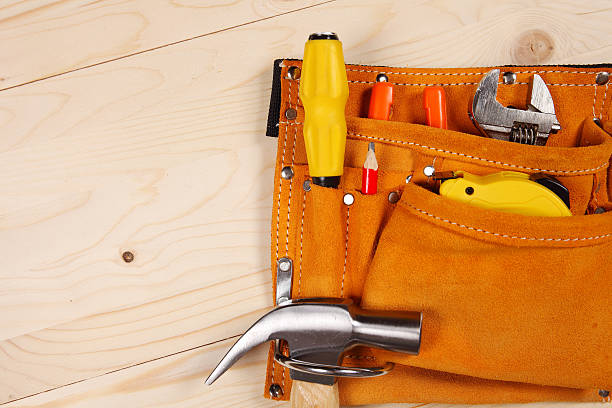 istock Set of working tools on wooden background 599884090