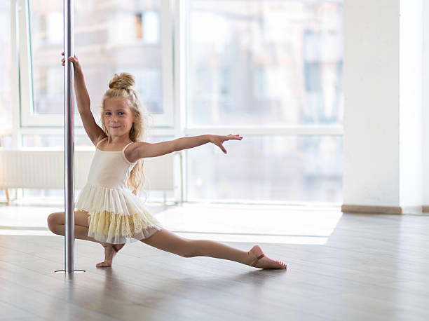 Beautiful little dancer in a dance studio