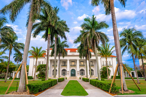 West Palm Beach, FL, USA - April 4, 2016: The Flagler Museum exterior and grounds. The beaux arts mansion was constructed by the oil tycoon Henry Flagler.