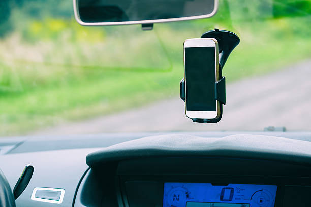 istock Smart phone in the car holder 599885332