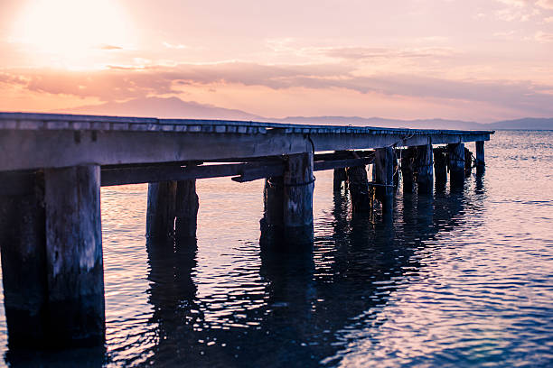 istock Wooden deck at the Sea at Sunset 599885786