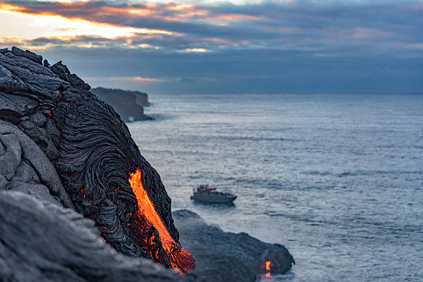 Lava from the Kilauea volcano floes into the Pacific ocean stock photo