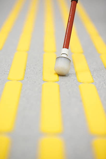 istock Blind pedestrian walking on tactile paving 599887882