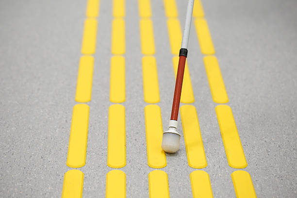 istock Blind pedestrian walking on tactile paving 599888034