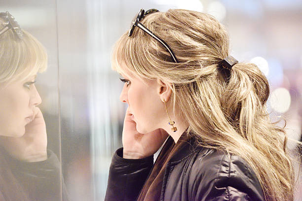 istock Shopping Stockholm blonde, store window 599889130