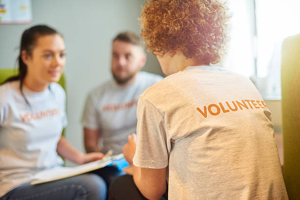istock volunteers in a team briefing 599890832