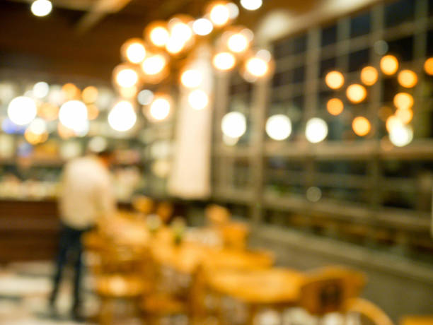 istock Blurred people and bokeh light in cafe background 599893260