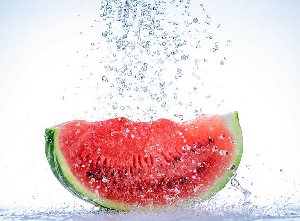 istock Red watermelon with splash of water 599893316