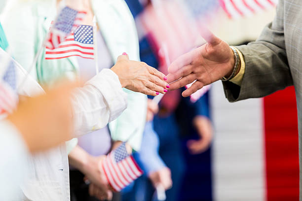 istock Local politician shaking hands with supporters at event 599893734