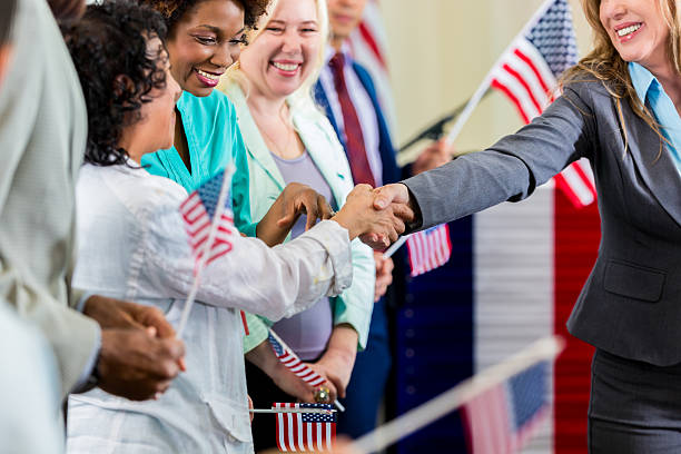 istock Local political candidate shaking hands with supporters at event 599893846