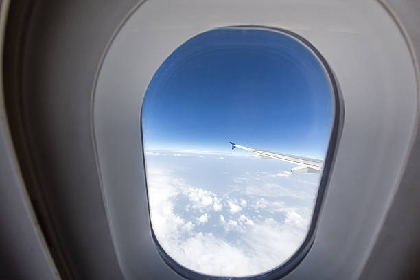 istock Airplane seat and window inside an aircraft. 599895128