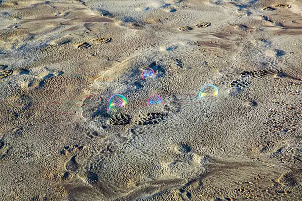 Soap-Bubbles on Sandy beach. Westport, New Zealand.