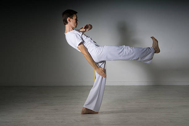 istock Man in sportswear performing a kick. 599895866