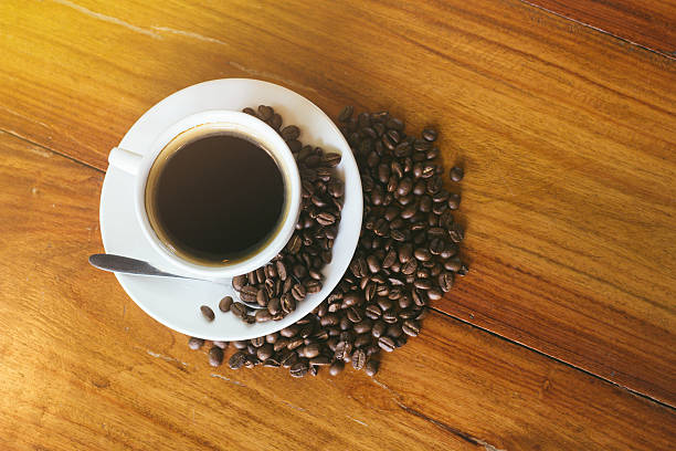 istock Cup of coffee on a wooden table 599896132