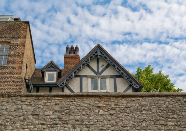 istock Medieval house seen under from Tower wall in London, England 599897074