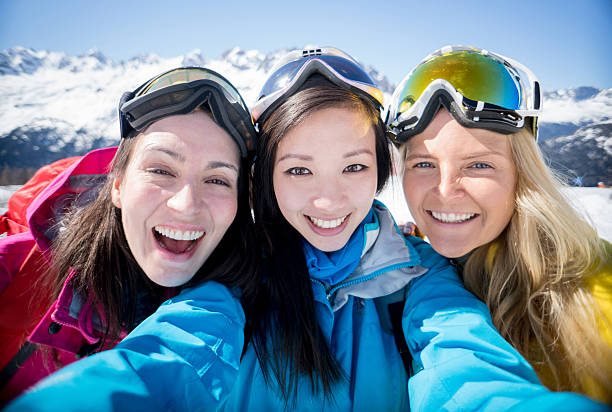 istock Group of friends skiing and taking a selfie 599897268