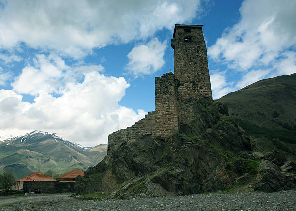 istock Svan guard tower on a background of snow-capped mountain 599897698