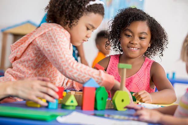istock Fun friends play with blocks together 599899864