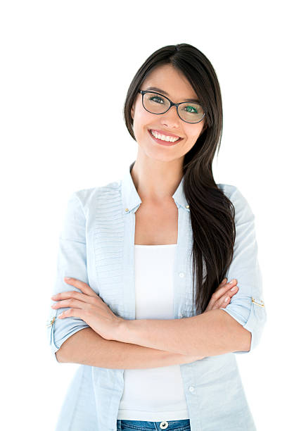 Latin American woman wearing glasses Casual Latin American woman wearing glasses with arms crossed and smiling - isolated over a white background women beautiful studio shot isolated on white stock pictures, royalty-free photos & images