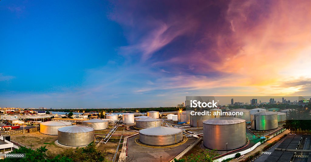 Industrial oil tanks in a refinery at twilight Storage Tank Stock Photo