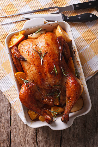 istock baked chicken with apples in the baking dish closeup. vertical 599901580