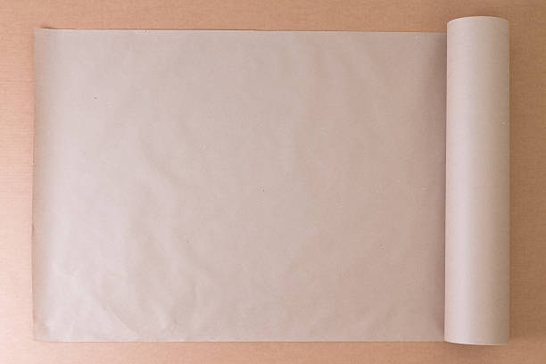 istock Opened roll of plain brown paper on cardboard 599901716