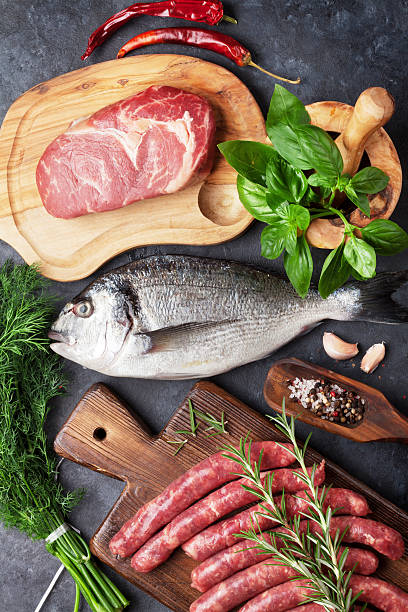 istock Sausages, fish and meat cooking 599902650