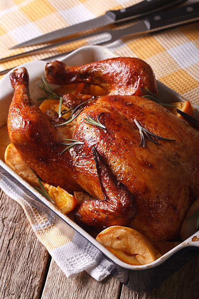 istock Beautiful baked chicken with oranges and apples 599903118