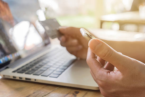 istock Online payment,Man's hands holding a credit card 599906498