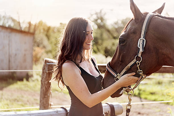 istock Woman with her horse 599907826