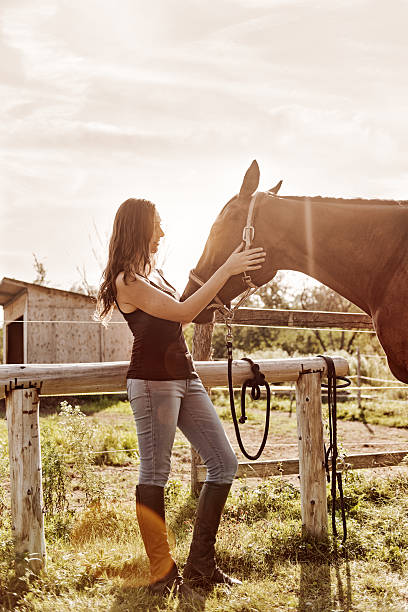 istock Woman with her horse 599907924