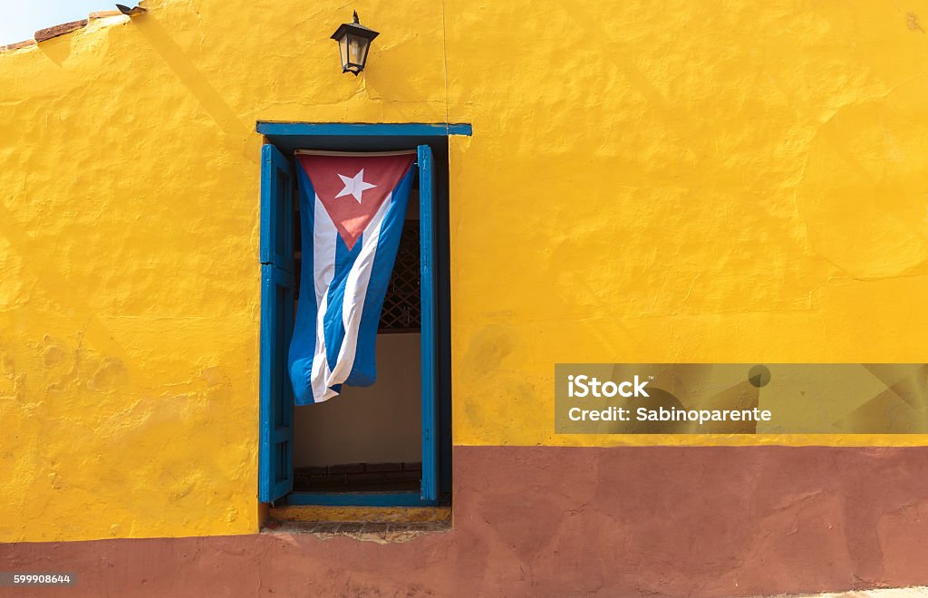 Cuba Cuban flag hanging on a door in Trinidad, Cuba Cuba Stock Photo