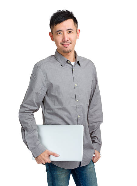 istock Chinese man holding a laptop 599908772
