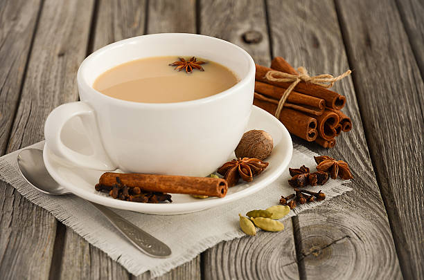 Indian masala chai tea. Spiced tea with milk. Indian masala chai tea. Spiced tea with milk on the rustic wooden table. Horizontal permission. Selective focus. Copy space. chai stock pictures, royalty-free photos & images