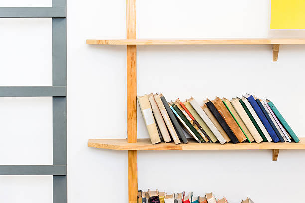 istock Bookshelf with books in a white designed interior 599910298