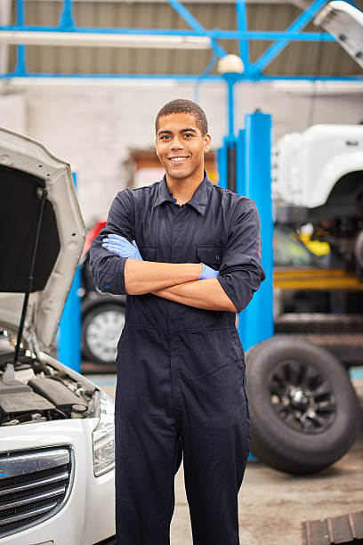 istock Proud mechanic smiles to camera 599910498