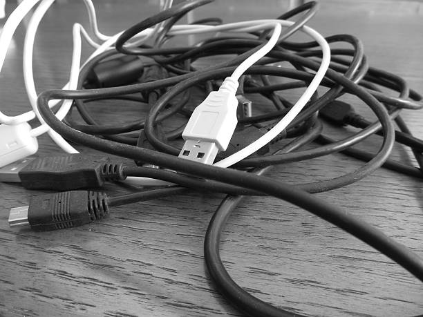 A micro USB cable used for cameras and other electronic devices.  Isolated on white.