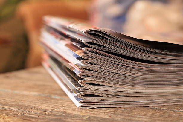 istock Magazines on the wooden table 599911398