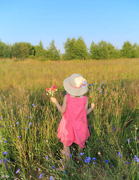 istock Girl in meadow. 599912078