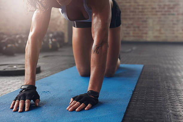 istock Female working out on exercise mat 599912958